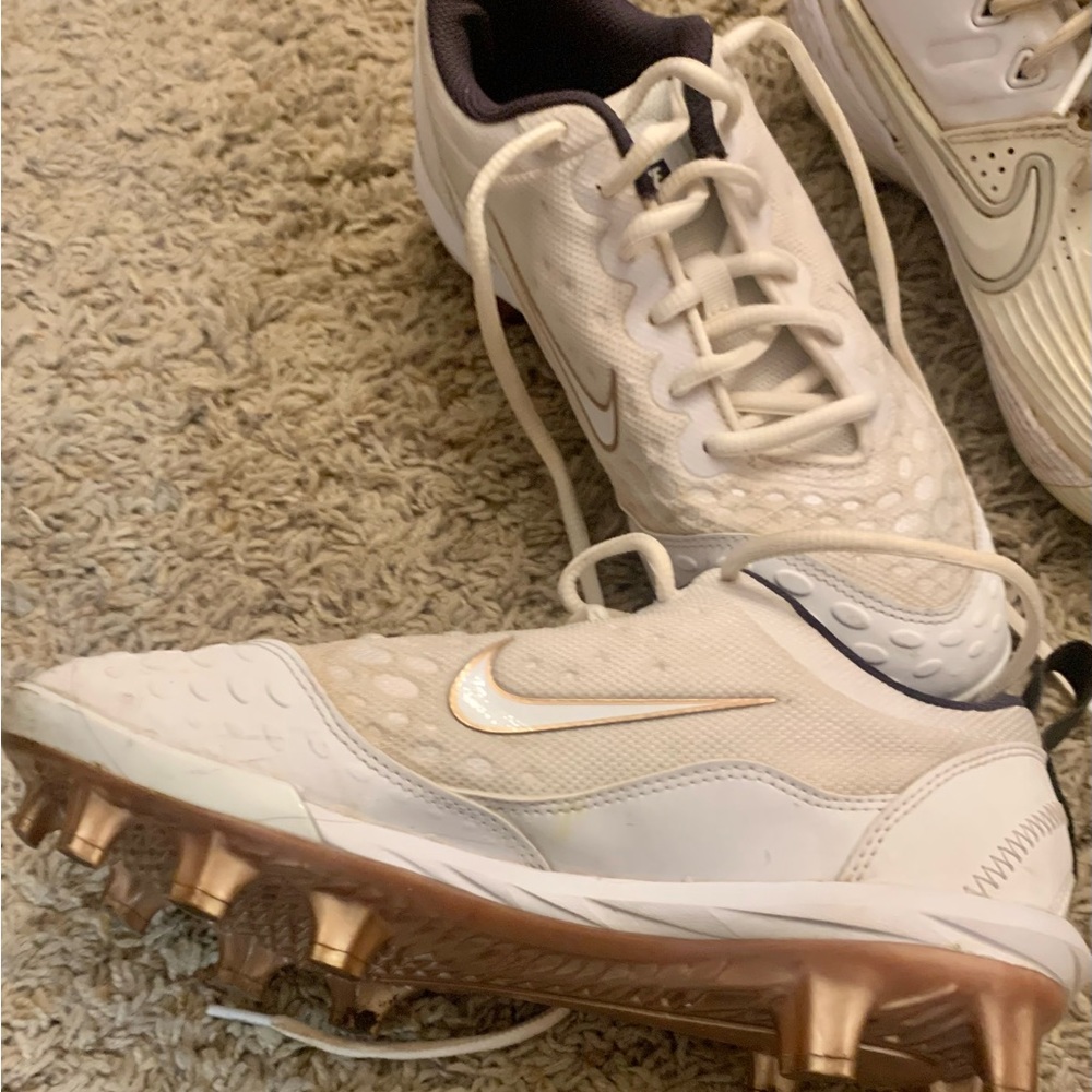 Used softball cleats a lot of wear left in these. White with rose gold